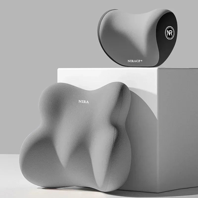 A gray ergonomic memory foam pillow for car neck and lumbar support displayed on a white box.