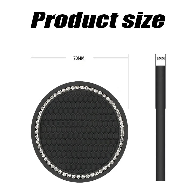A black decorative coaster with a textured surface and an outer rim of clear rhinestones.