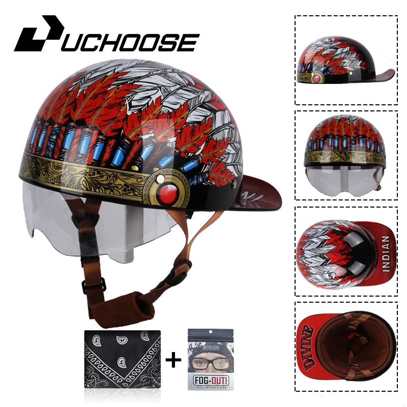 A black motorcycle helmet with a red and silver leaf design, shown next to accessories like sunglasses and a leather pouch.