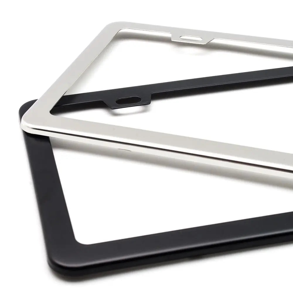 A set of stainless steel car license plate frames in black and silver finishes.