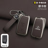 A dark brown Lexus car key cover shell and a leather strap are shown on a dark background.