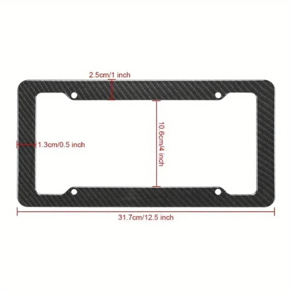 Black carbon fiber license plate frame with mounting hardware, measuring 31.7cm by 10.6cm.