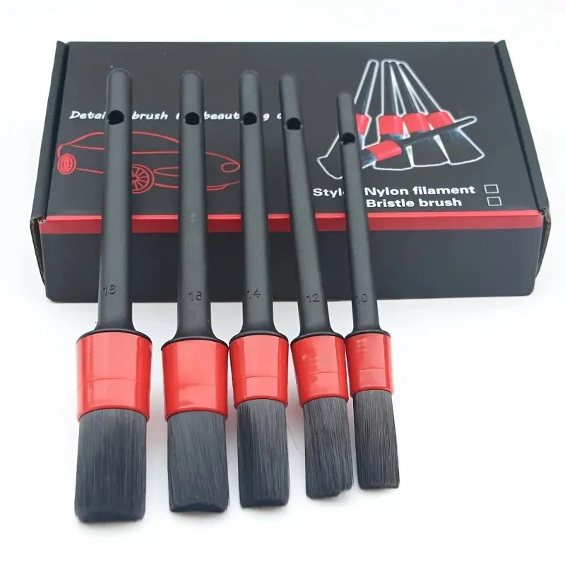 A set of professional car detailing brushes with nylon filaments and bristles displayed in a black box.
