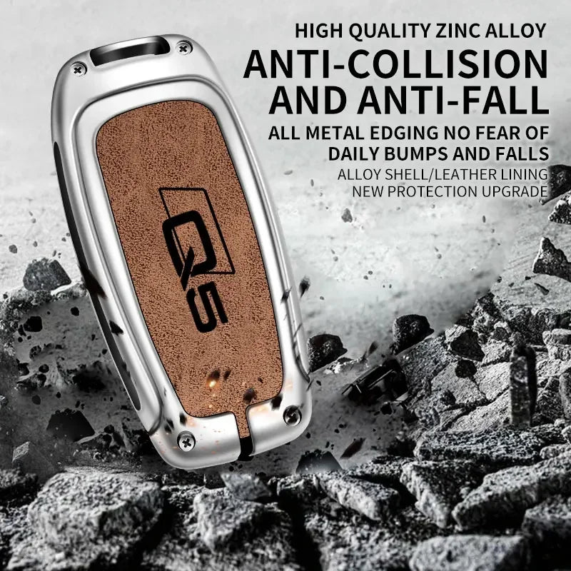 A close-up of an Audi Q5 key fob cover made of high-quality zinc alloy with anti-collision and anti-fall features resting on 