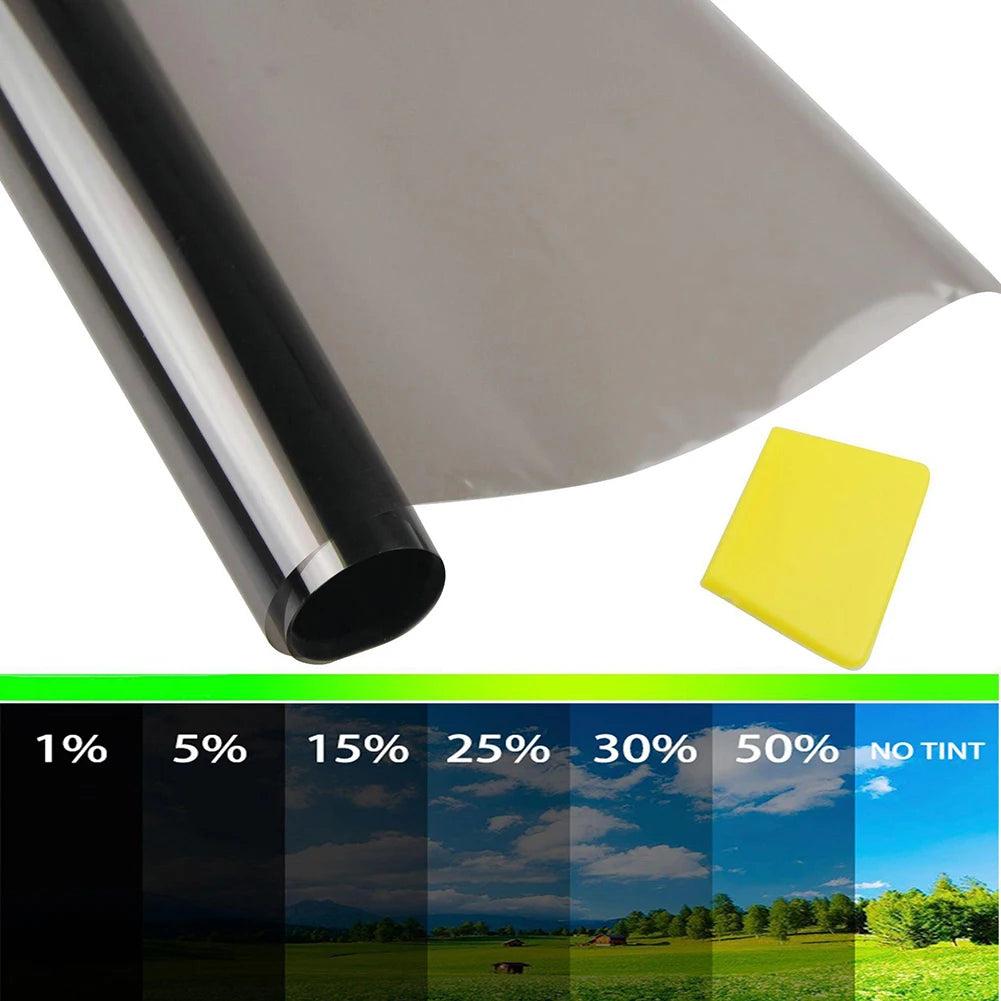 A roll of car window tint film next to a yellow tint sample and a color gradient chart showing tint percentages.