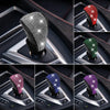 A collection of gear shift knob covers featuring various colors and rhinestone patterns for protection.