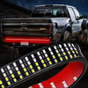 A high-intensity LED light bar mounted on the tailgate of a silver pickup truck.