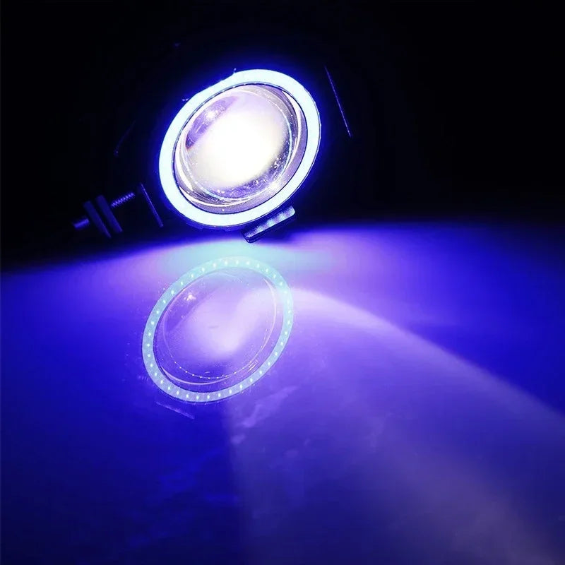 A bright white LED spotlight illuminates a blue planetary surface in the dark.