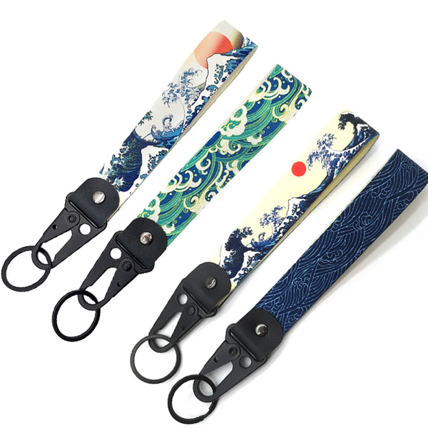 A set of JDM car keychain lanyards featuring blue and white traditional wave patterns.