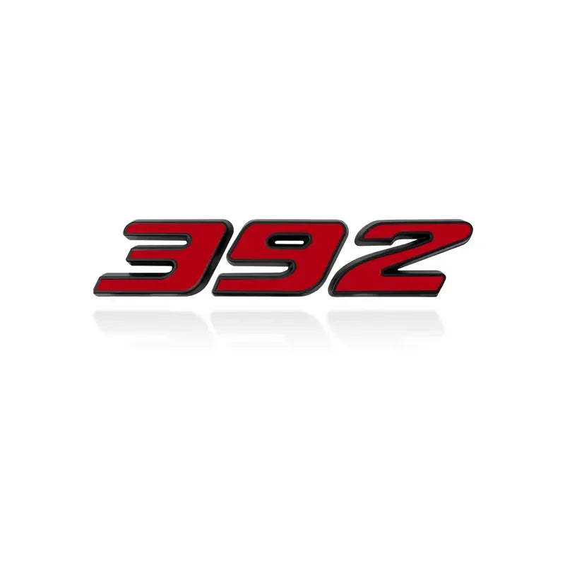 A close-up view of a 3D metal car fender side and trunk decal with the number 392 in red and black.