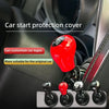 A close-up view of a red car start protection cover accessory for a car ignition switch.