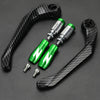 A set of black carbon fiber motorcycle levers and handguard protectors with green accents.