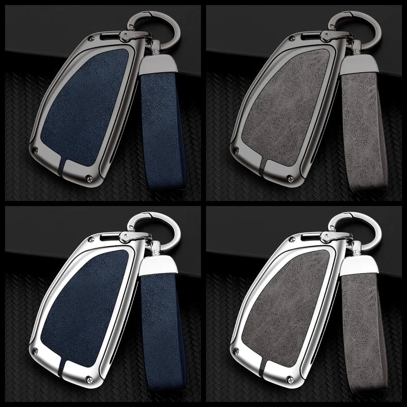 A pair of durable zinc alloy car key cases in black and blue leather accents shown from the side.