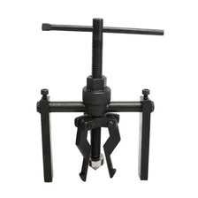 A black three-claw bearing puller tool used for internal and external removal.