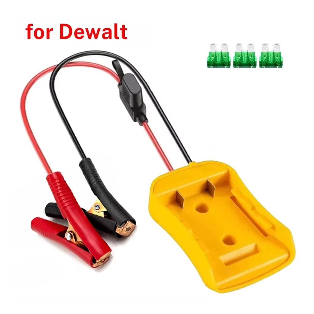 A yellow battery jumper clamp with a black connector and red wire, shown next to multiple green battery clamps.