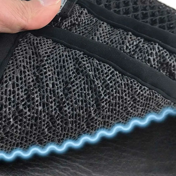 Close-up of a black mesh motorcycle seat cushion cover with blue piping.