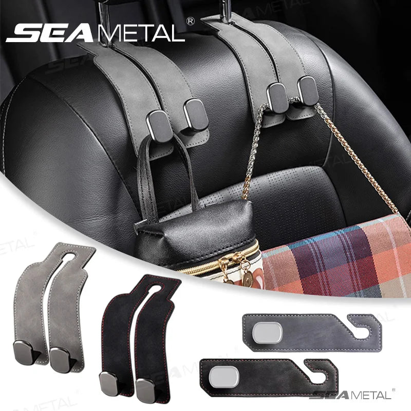 Black leather car seat back storage hooks and mounting hardware for securing items.
