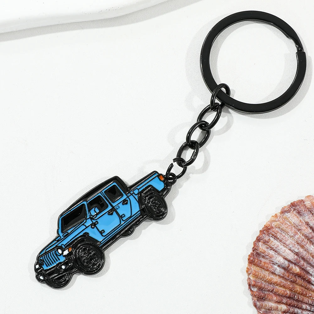 A black chain keychain featuring a blue classic alloy car design.