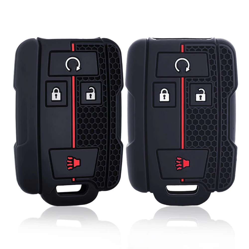 A pair of black silicone car key covers featuring multiple keyholes and a red accent line.