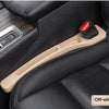 A beige gap plug strip is installed in the black leather car seat for protection.