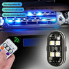 A hand holds a remote control for multi-mode RGB strobe warning lights installed on a vehicle's grille.