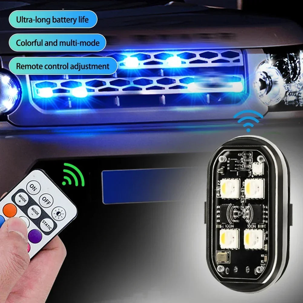 A hand holds a remote control for multi-mode RGB strobe warning lights installed on a vehicle's grille.