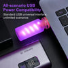 Une veilleuse filament LED violette USB à côté d'un clavier d'ordinateur portable.