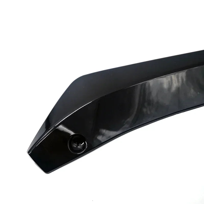 Black universal carbon fiber bumper lip spoiler for cars.