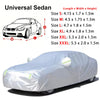 A white, waterproof car cover draped over a sedan, shown in profile.
