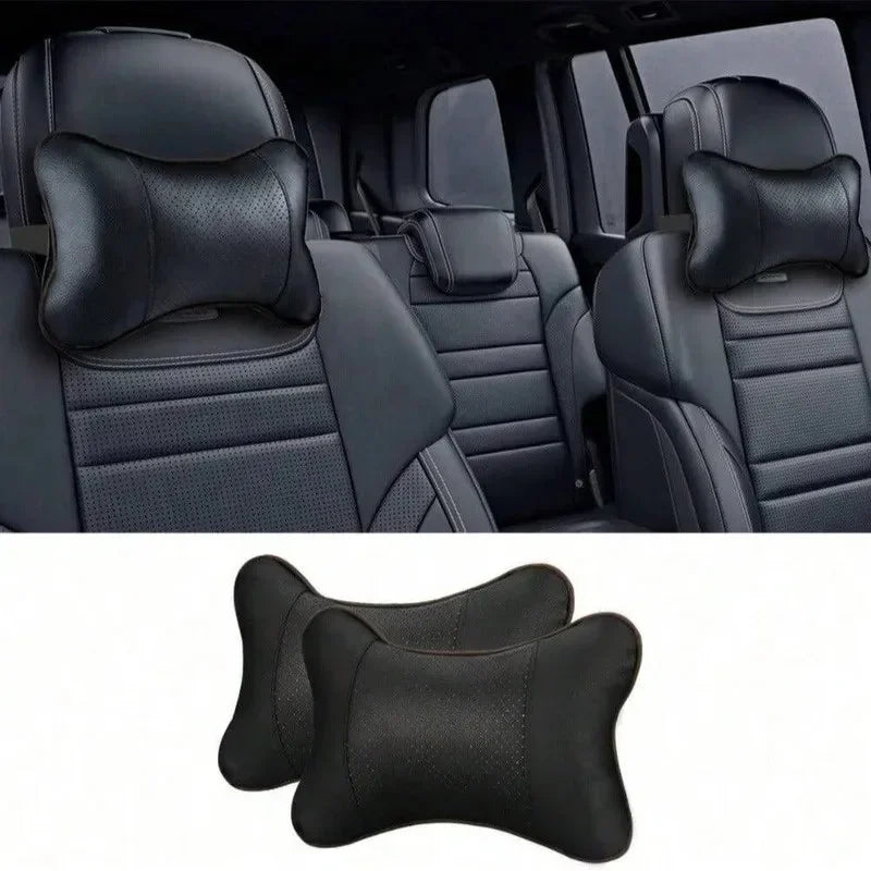 Black ergonomic auto headrest cushion with supportive neck padding shown in a car interior.