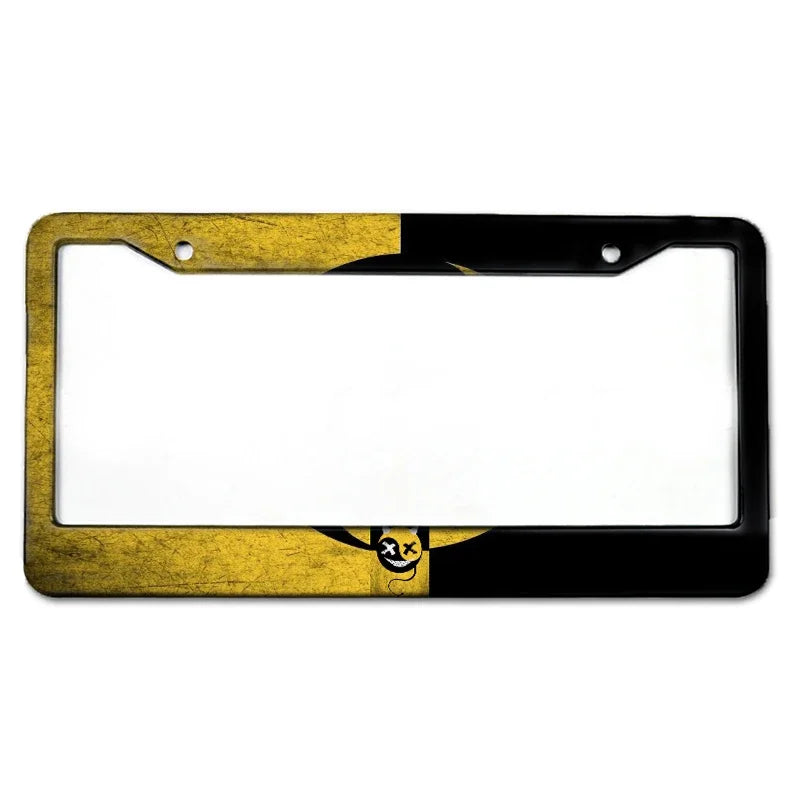 A rectangular aluminum license plate frame with a black and gold design.