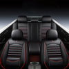 Interior view of a car with black leather seats and red stitching, showing universal seat covers.