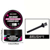 A black jar of car grease for door tracks and sunroof noise with an attached brush.