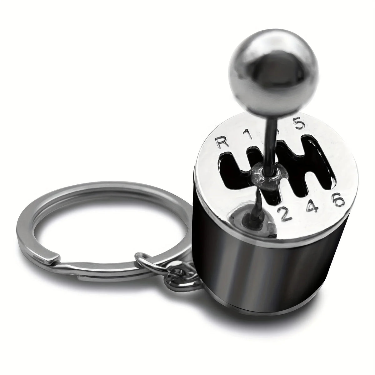 A silver keychain with a spherical top and numbered markings for desk stress relief.