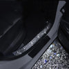 Close-up of a car interior showing a decorative diamond trim strip on the body panel.