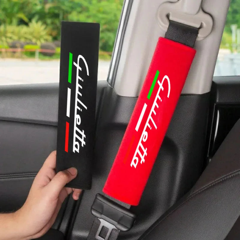A red car seat belt shoulder cushion is shown in a car interior setting.