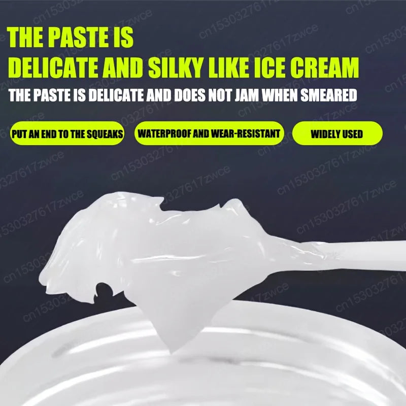 A white paste is smeared on a surface, demonstrating its delicate and silky texture.