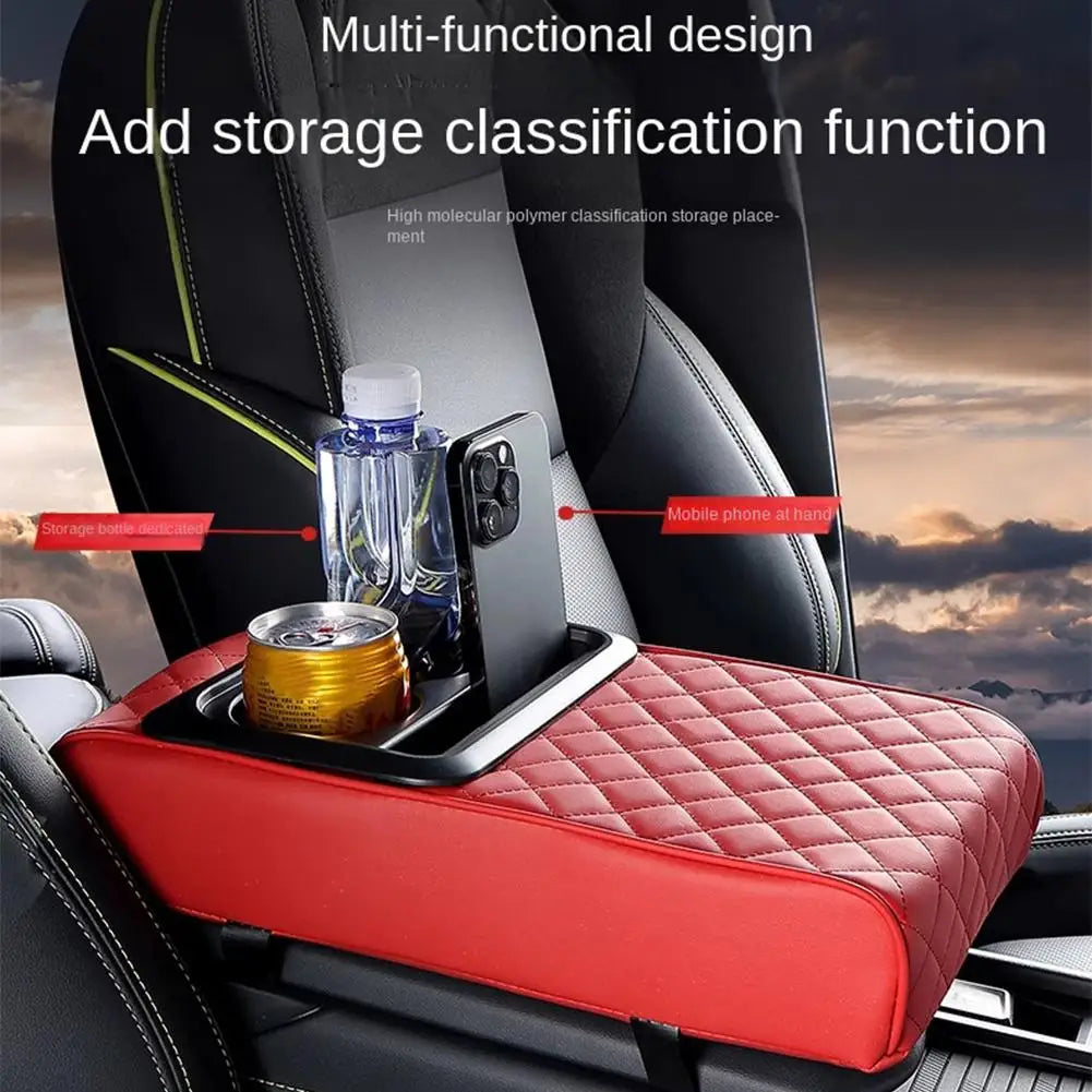 A red car armrest cushion with an integrated cup holder and storage for a bottle and a mobile phone.