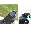 A motorcycle seat cushion cover in black and green is shown on a bike, designed for heat insulation and protection.