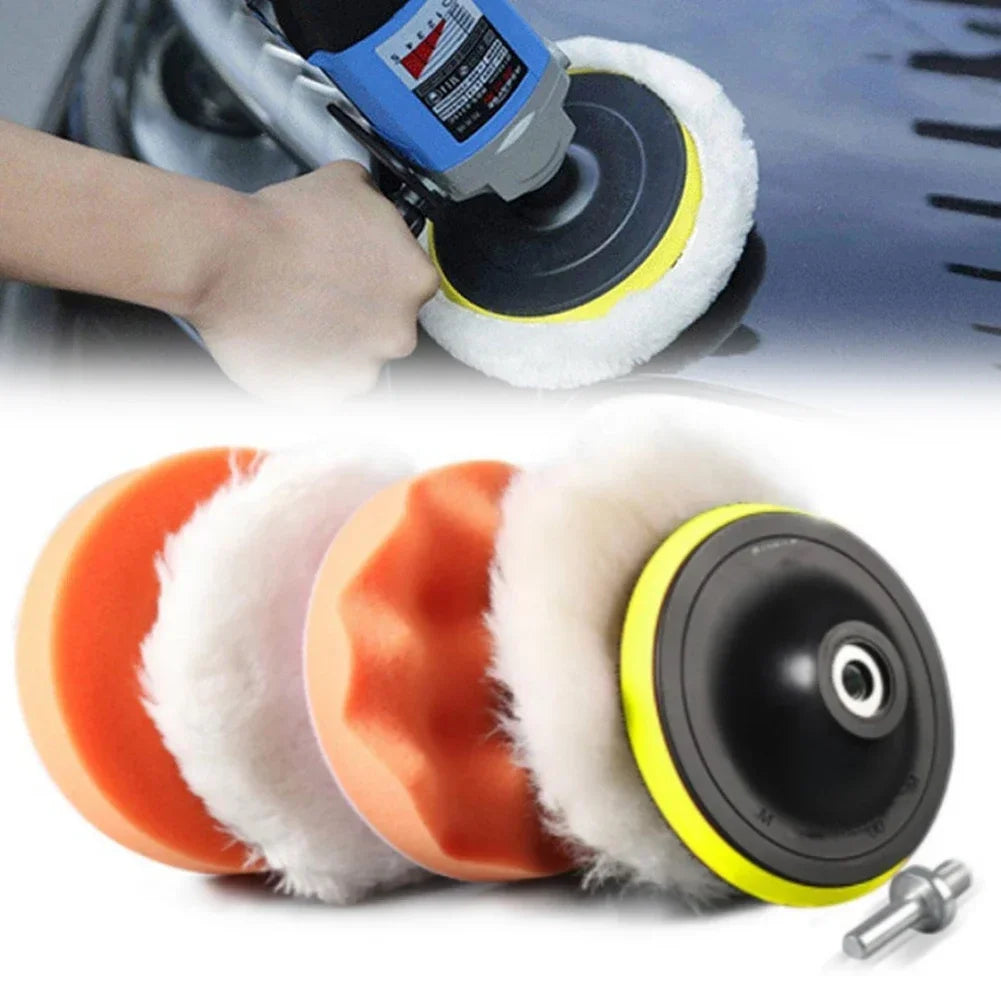 A set of orange and black car polishing pads with white foam, used for professional car detailing.