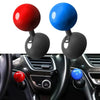 Close-up view of a push start ignition button cover with red and blue colored buttons on a car interior panel.