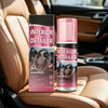 A bottle of Interior Detailer spray next to its packaging in a car interior setting.
