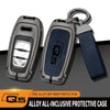 A protective case for an Audi Q5 key fob made of zinc alloy with a dark blue grip.