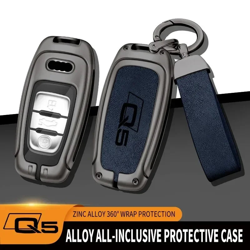 A protective case for an Audi Q5 key fob made of zinc alloy with a dark blue grip.