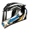 A black and white racing-style ABS motorcycle helmet with blue accents and a gold star design.
