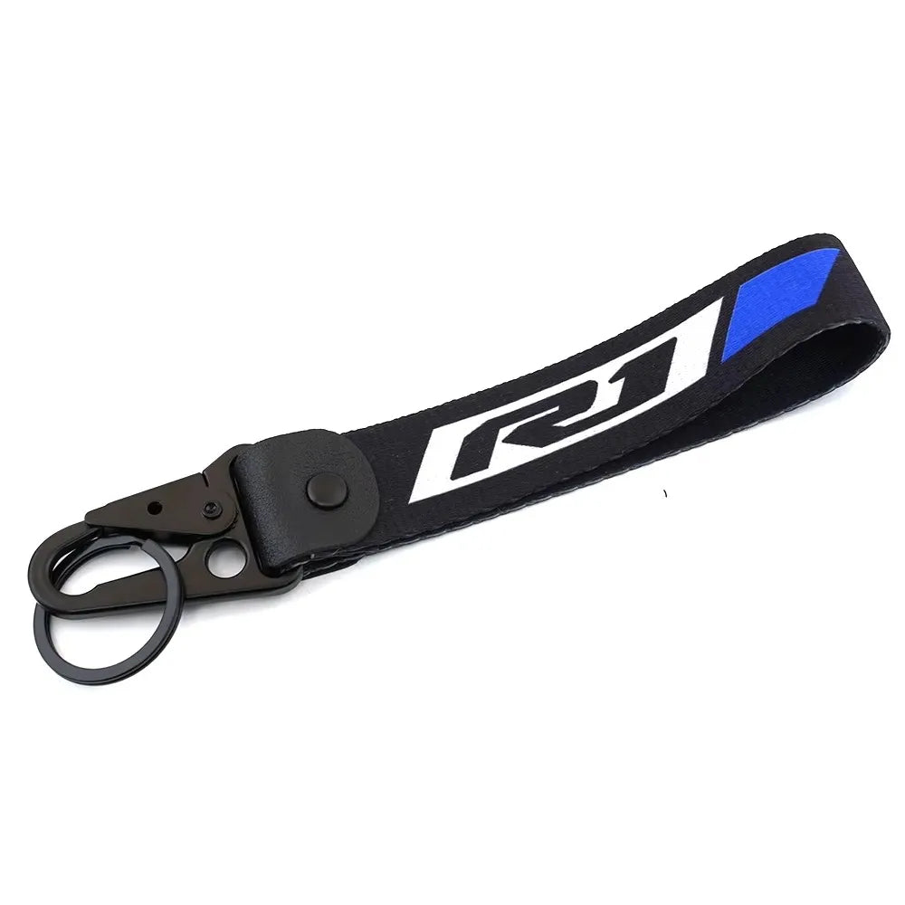 Cache du réservoir de liquide de frein noir et bleu de moto avec une boucle de clé USB.
