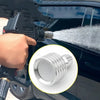 A hand is attaching a high-pressure stainless steel shower head nozzle to a car window, spraying water.