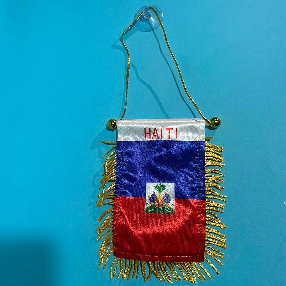 A double-sided polyester flag of Haiti featuring the national colors and emblem, suspended by a gold cord.