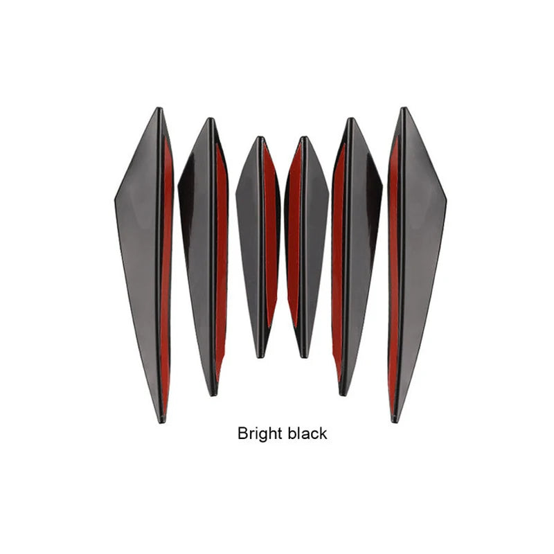 A set of five bright black universal car spoiler fins for the front bumper.
