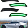 Close-up view of green LED turn signal lights installed on a silver Camaro or Cadillac vehicle.